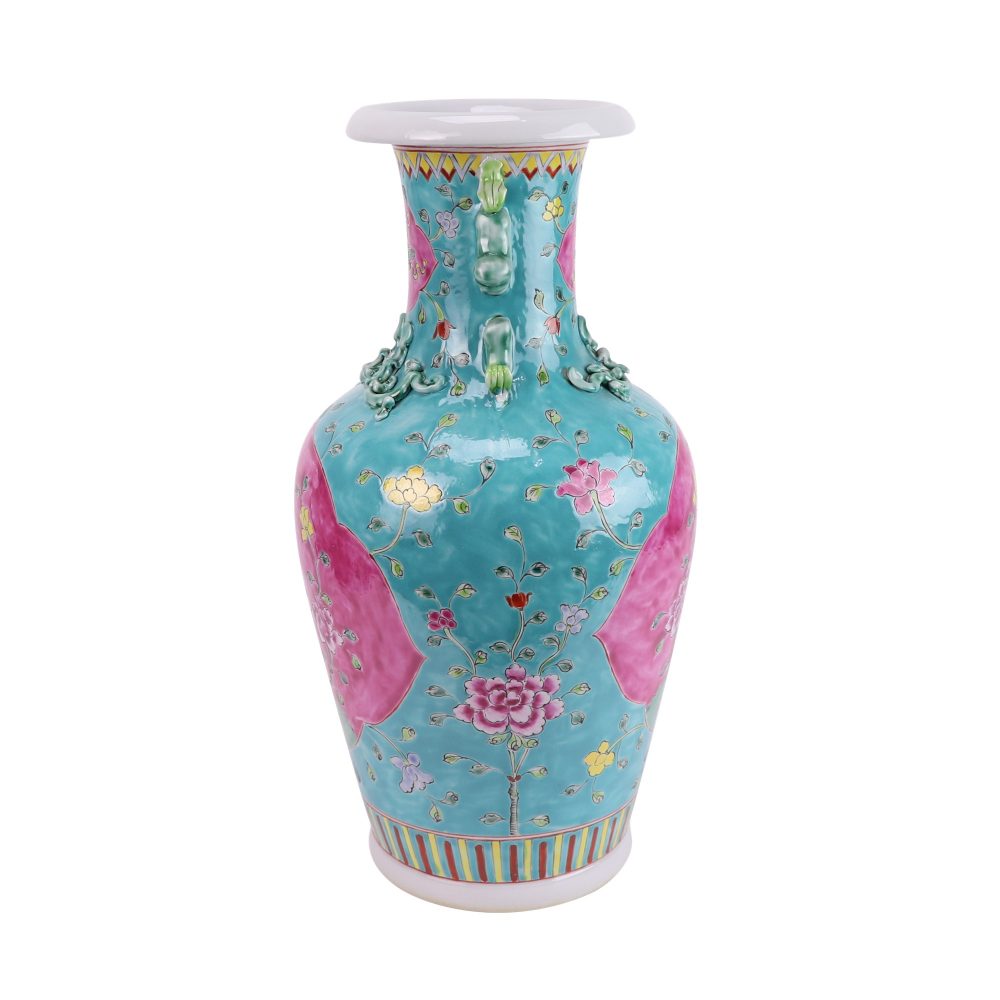 Side view of a two-eared ceramic vase with a peony design on a green ground in famille-rose enamel on a black ground